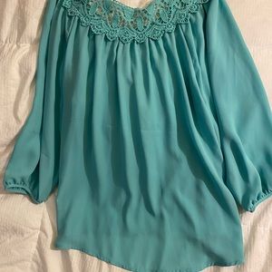Aquamarine color blouse with floral design
